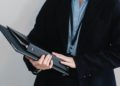 Photo by Sora Shimazaki: https://www.pexels.com/photo/crop-faceless-office-employee-with-folders-in-hands-5668770/