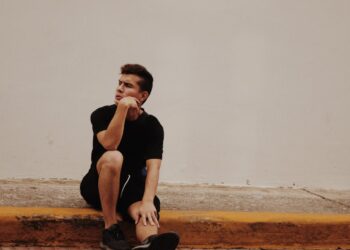 Photo by Ariel Paredes: https://www.pexels.com/photo/photo-of-man-with-hand-on-chin-sitting-on-concrete-pavement-in-front-of-white-wall-2218208/