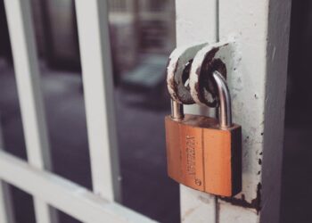 Photo by Bich Tran: https://www.pexels.com/photo/closeup-photography-of-white-gate-with-brass-colored-padlock-846288/