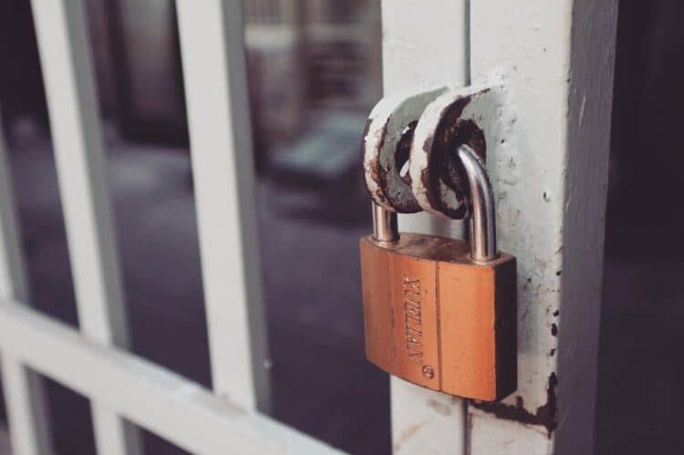 Photo by Bich Tran: https://www.pexels.com/photo/closeup-photography-of-white-gate-with-brass-colored-padlock-846288/