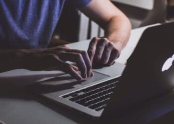Photo by freestocks.org: https://www.pexels.com/photo/person-touching-open-macbook-on-table-839465/
