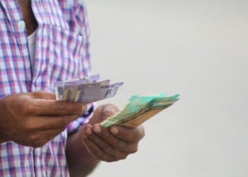 Photo by Moon Bhuyan: https://www.pexels.com/photo/person-holding-paper-money-and-counting-13823020/