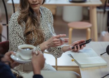 Photo by George Milton: https://www.pexels.com/photo/multiethnic-businesswomen-drinking-coffee-and-surfing-smartphone-at-table-6953830/