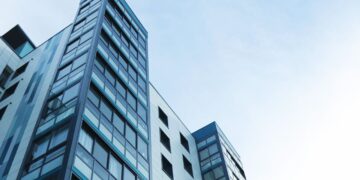 Photo by Expect Best: https://www.pexels.com/photo/low-angle-view-of-office-building-against-sky-323705/