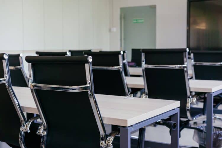 Photo by Mikhail Nilov: https://www.pexels.com/photo/chairs-in-a-conference-room-9300765/