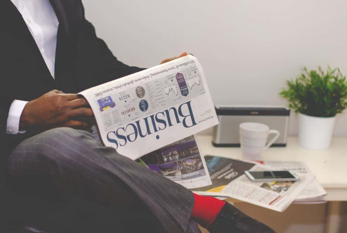 Photo by nappy: https://www.pexels.com/photo/man-reading-newspaper-while-sitting-near-table-with-smartphone-and-cup-935979/