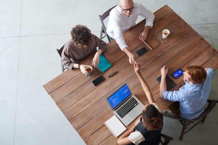 Photo by fauxels: https://www.pexels.com/photo/four-people-sitting-beside-wooden-table-3184327/