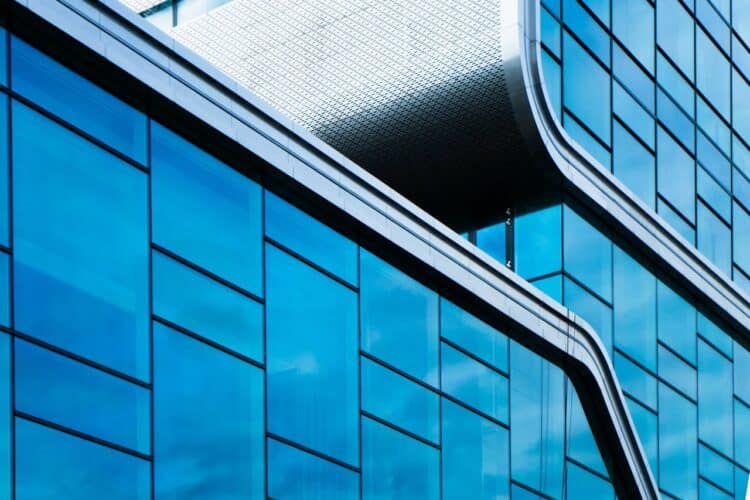 Photo by Redney : https://www.pexels.com/photo/abstract-modern-architecture-with-blue-glass-facade-29464842/