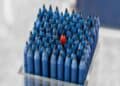 Photo by aboodi vesakaran: https://www.pexels.com/photo/box-of-blue-pencils-with-a-standing-out-single-red-pencil-in-the-middle-18889472/