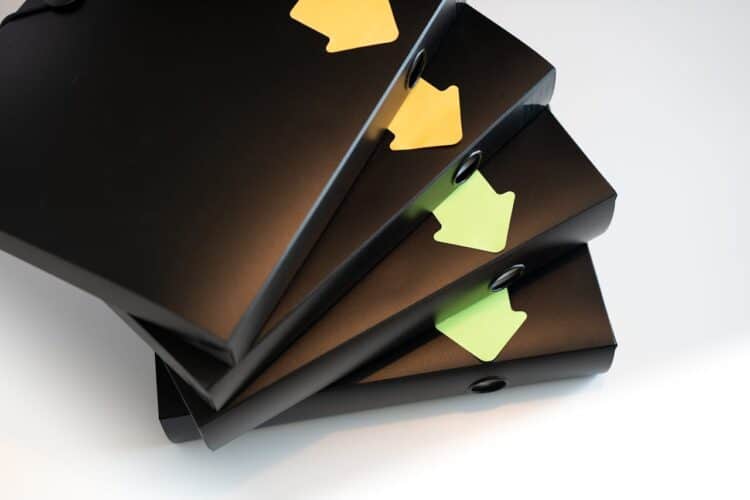 Photo by Jakub Zerdzicki: https://www.pexels.com/photo/black-folders-with-documents-and-contracts-isolated-on-a-white-background-segregated-with-stickers-in-the-shape-of-arrows-workflow-direction-office-work-and-household-bills-16978372/