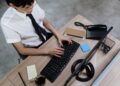 Photo by Ron Lach : https://www.pexels.com/photo/an-employee-typing-on-his-keyboard-8691820/