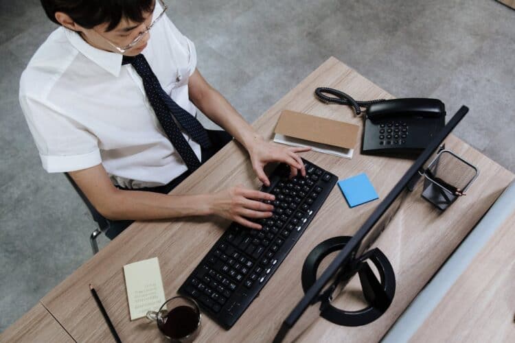 Photo by Ron Lach : https://www.pexels.com/photo/an-employee-typing-on-his-keyboard-8691820/