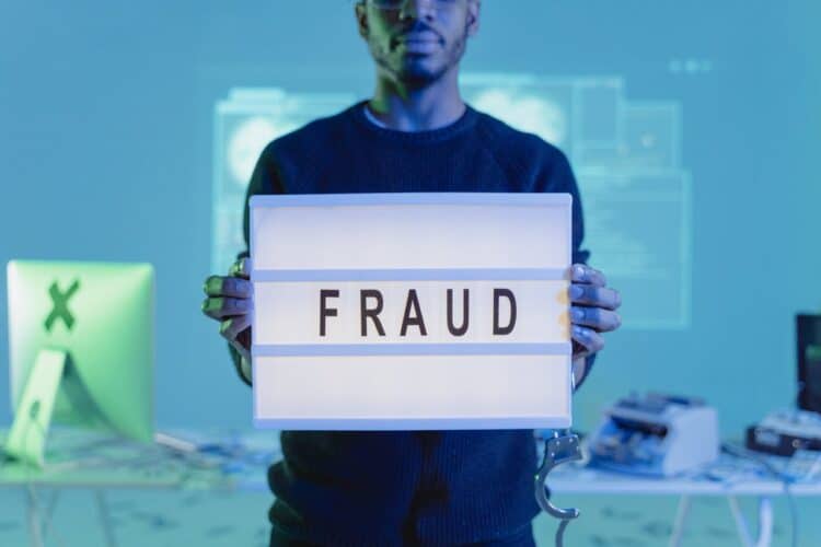 Photo by Tima Miroshnichenko: https://www.pexels.com/photo/a-man-in-black-sweater-holding-letter-board-with-fraud-text-6266311/