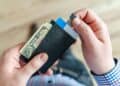 Photo by Lukas: https://www.pexels.com/photo/person-holding-black-card-holder-928181/