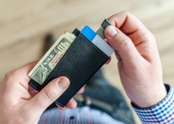 Photo by Lukas: https://www.pexels.com/photo/person-holding-black-card-holder-928181/