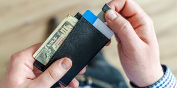 Photo by Lukas: https://www.pexels.com/photo/person-holding-black-card-holder-928181/