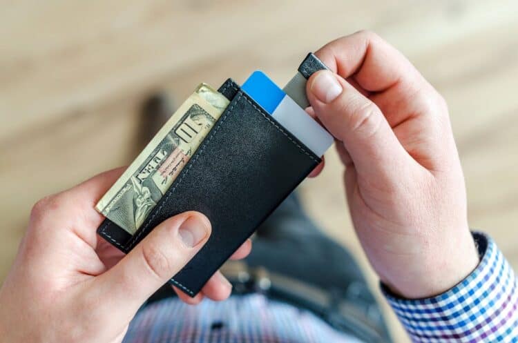 Photo by Lukas: https://www.pexels.com/photo/person-holding-black-card-holder-928181/