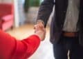 Photo by Kampus Production: https://www.pexels.com/photo/hand-shake-of-man-in-black-suit-jacket-and-woman-in-red-long-sleeves-8439706/