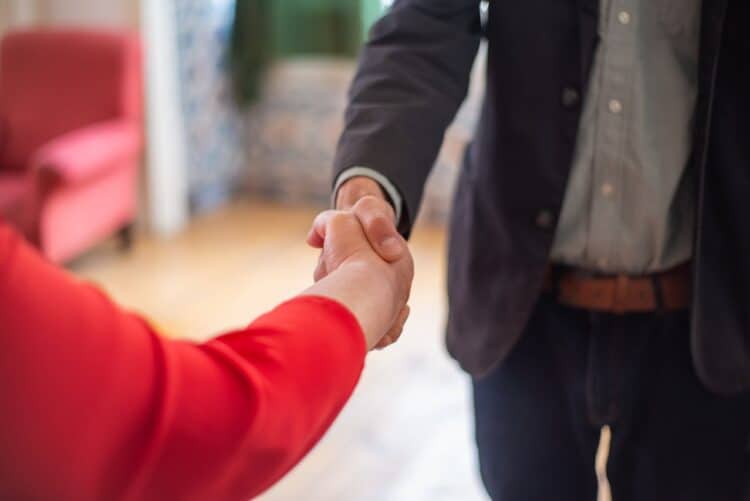 Photo by Kampus Production: https://www.pexels.com/photo/hand-shake-of-man-in-black-suit-jacket-and-woman-in-red-long-sleeves-8439706/