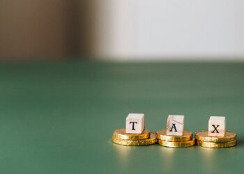 Photo by Nataliya Vaitkevich: https://www.pexels.com/photo/tax-word-on-top-of-gold-coins-6863186/