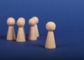Photo by Ann H: https://www.pexels.com/photo/wooden-person-figures-on-blue-background-6589280/