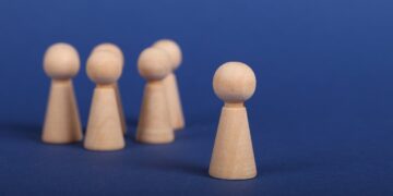 Photo by Ann H: https://www.pexels.com/photo/wooden-person-figures-on-blue-background-6589280/
