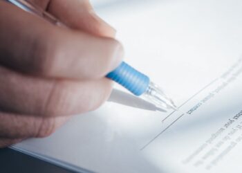 Photo by Kindel Media: https://www.pexels.com/photo/a-person-writing-on-a-paper-7054510/
