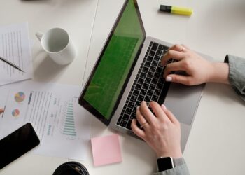 Photo by Alena Shekhovtcova: https://www.pexels.com/photo/a-person-using-a-laptop-8067802/