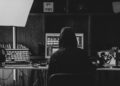 Photo by Amar  Preciado: https://www.pexels.com/photo/grayscale-photo-of-person-sitting-on-chair-in-front-of-computer-11063291/