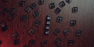 Photo by Mikhail Nilov: https://www.pexels.com/photo/keycaps-on-a-brown-surface-6964373/