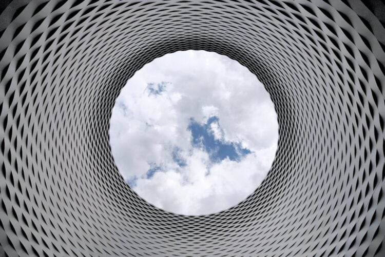 Photo by Pixabay: https://www.pexels.com/photo/low-angle-photography-of-grey-and-black-tunnel-overlooking-white-cloudy-and-blue-sky-210158/